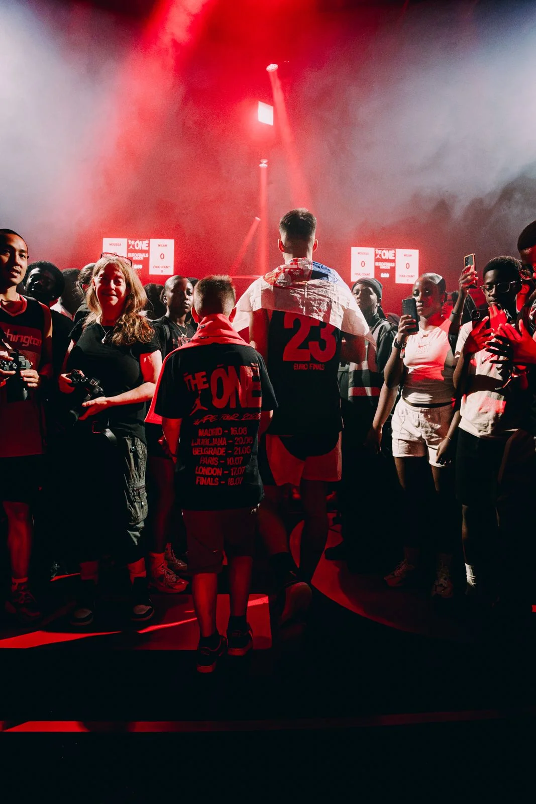 Players and fans under red lights at the Jordan The One Euro Finals